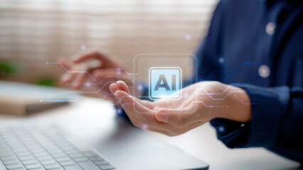 Close-up of hand holding virtual AI icon with futuristic interface. Concept of artificial intelligence assistant used in everyday life, smart tech, and digital innovation.
