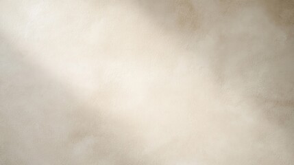 Obraz premium A textured beige surface with subtle variations in shading, resembling a plastered or stucco wall.