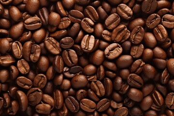 Freshly roasted coffee beans in various shades of brown