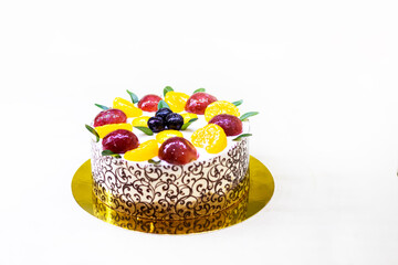 sponge cake with grapes, orange slices and curd cream