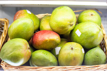 farm ripe mango in a container in a supermarket