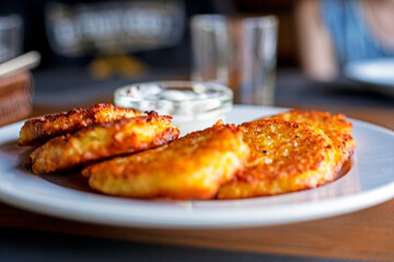 national ukrainian food drannyk with potatoes and sour cream