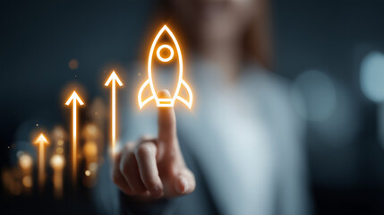 A businesswoman's finger touches a glowing holographic rocket surrounded by upward arrows, symbolizing startup launch, rapid growth and innovative success in today's digital environment