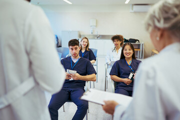 Medical team attending conference in modern hospital setting