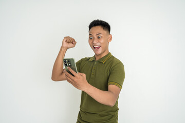Excited Individual Celebrating Victory While Using a Smartphone Against White Background