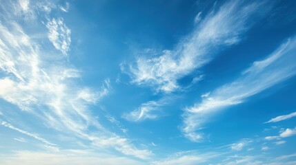 Fototapeta premium Stunning Blue Sky with Wispy White Clouds A Serene Nature Photography