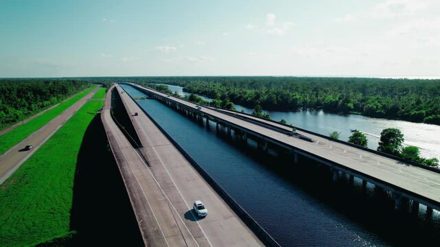Boat gliding through Maurepas Swamp near LaPlace, Louisiana&mdash;perfect for environmental and nature documentaries.