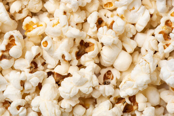 Background in the form of salted popcorn. Flat lay, top view