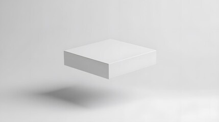Minimalist white cube hovering in a bright white space casting a soft shadow on the surface below it