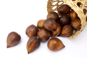 Close-up of snake fruit against white background. Salak, commonly known as snake fruit, is a unique tropical fruit native to Indonesia but is now widely cultivated across Southeast Asia. 