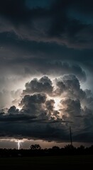 Fototapeta premium Storm Clouds Building with Lightning Strikes Over Open Landscape