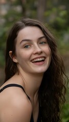 Fototapeta premium A woman smiling with her eyes closed