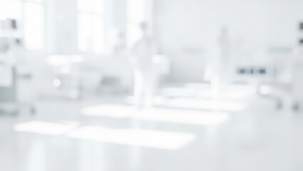 Blurred hospital interior with medical staff and equipment in a bright white setting.