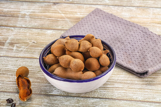 Tropical exotic Tamarind fruit heap