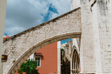 Stone Arch and Historic Ruins in Lisbon, Portugal with Blue Sky