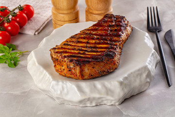 Grilled pork steak with bone