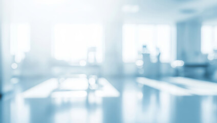 Blurred hospital interior with figures in the background and bright light.