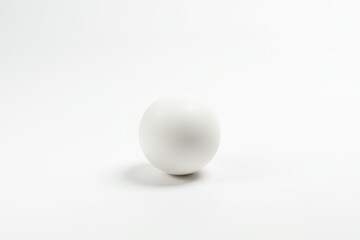Single white ping pong ball isolated on white