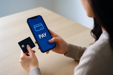 Mobile payment concept. Woman holding smartphone showing pay button with credit card