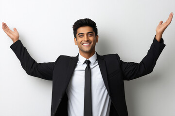 young indian cheerful businessman standing on white background