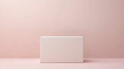 Minimalist box presentation against a soft pastel pink backdrop creates a clean, elegant space for product display or artistic composition.