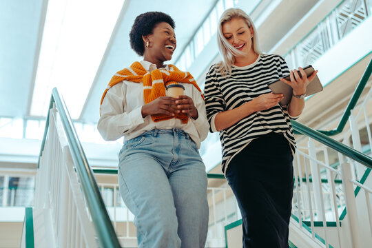Female colleagues walking at work