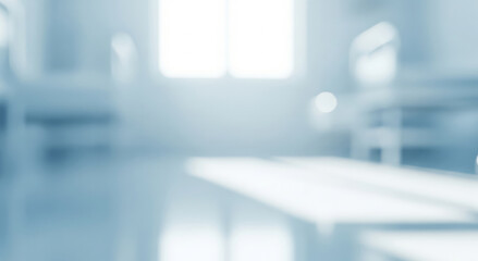 Blurred interior with light coming through a window creating a bright background.