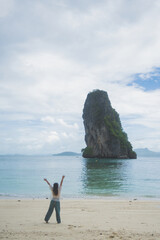 happy woman stand on the beach at krabi province, Thailand. soft focus