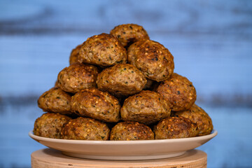 Baked minced cutlets stacked on a plate close-up