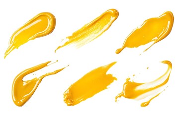 A collection of six strokes of vibrant yellow paint isolated against a clean white background surface