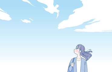 髪をなびかせる若い女性