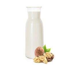 Nut milk in glass bottle and walnuts isolated on white