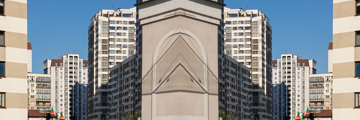 Cityscape on a sunny day. Modern building against the blue sky.