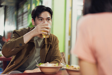 Enjoying authentic Vietnamese cuisine and drinks in a vibrant Hanoi eatery at night