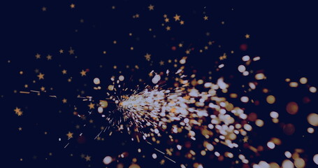 Radiating golden sparks fanning out in dark space, with sparkler creating star-shaped bokeh lights
