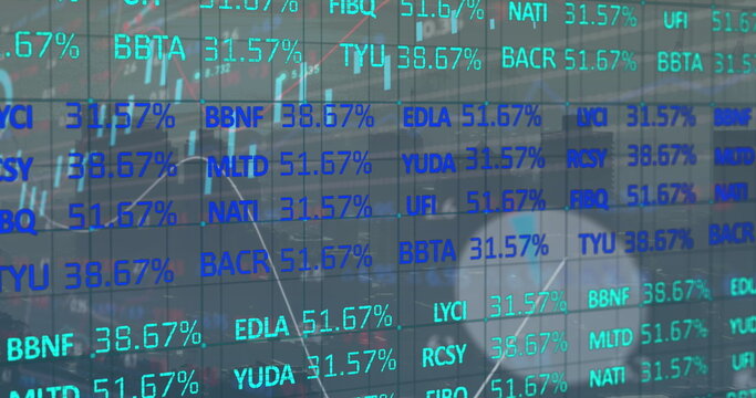 Displaying digital stock ticker on glass wall in office, reflecting computer monitors and desks