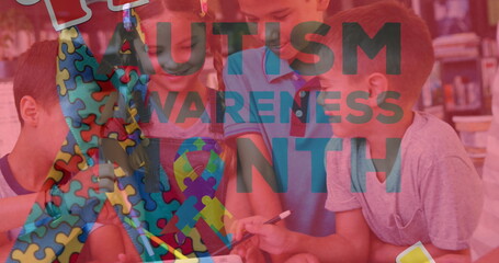 Drawing five students using markers and paper at library table, with Autism Awareness Month overlay