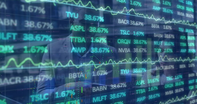 Gesturing male analyst in suit leaning toward transparent screen at office, with stock tickers