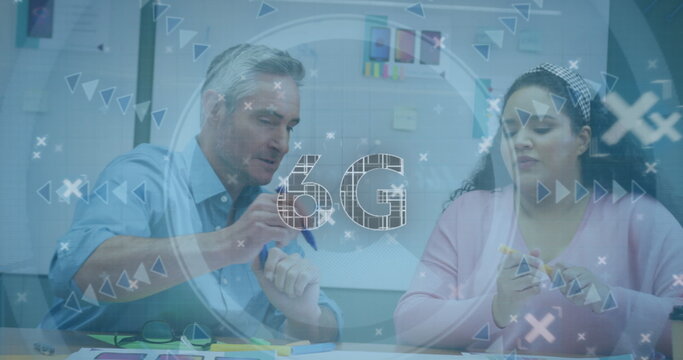 Colleagues gesturing toward charts and checking smartphone in office meeting room, with 6G overlay