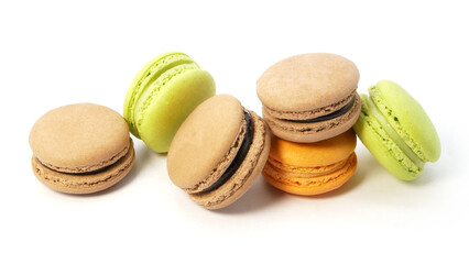 Pile of macaron cookies in various flavours and colours isolated on white background.