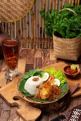 Nasi ayam rempah is a dish made with fragrant jasmine rice and spicy chicken, while nasi kari ayam...