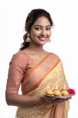 indian woman holding puja thali