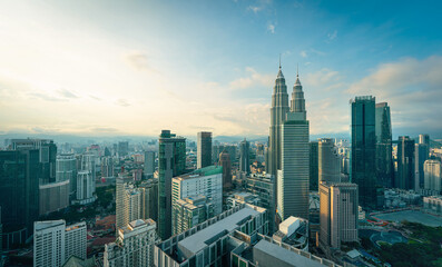 Fototapeta premium Panorama aerial serene view of beautiful Kuala Lumpur city skyline during sunrise.