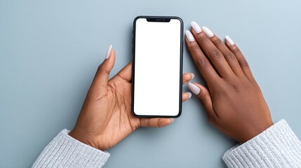 Hands holding a smartphone with a blank white screen on a gray background.