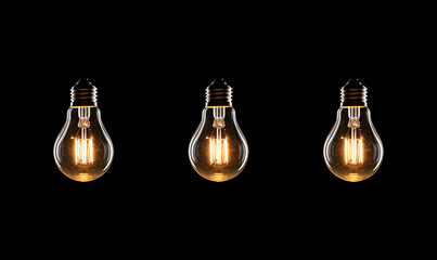 Electric incandescent lamp shines in the dark. Source of light. Symbol of idea. Many light bulbs on a black background