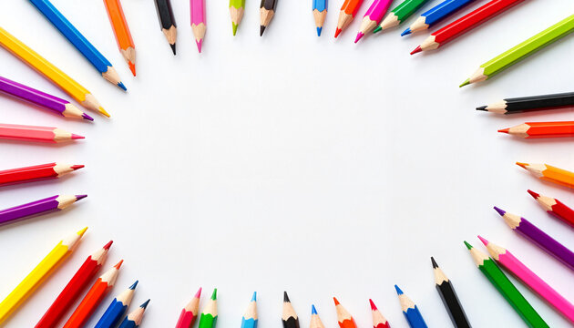 Assorted colored pencils arranged around blank paper, creativity and education, with copy space