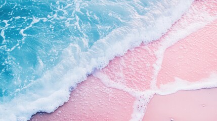 The blue and pink beach, with two or three small flowers dotting the picture. The background is the sparkling water, with thin strips of white foam, creating a bird's-eye view. The picture has soft to
