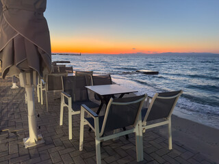 Restaurant on the beach on Chalkidiki island at sunset in Greece