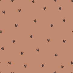Small dark polka dots on brown backround, seamless pattern. Cute pattern with hearts for wrapping paper, wallpaper, fabric.