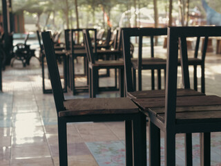 Empty black benches in a tourist park.